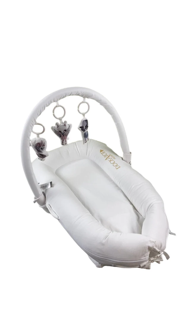 DockATot Deluxe+ Dock with Toy Arch, Pristine White, White Arch w/ Cloud Friends